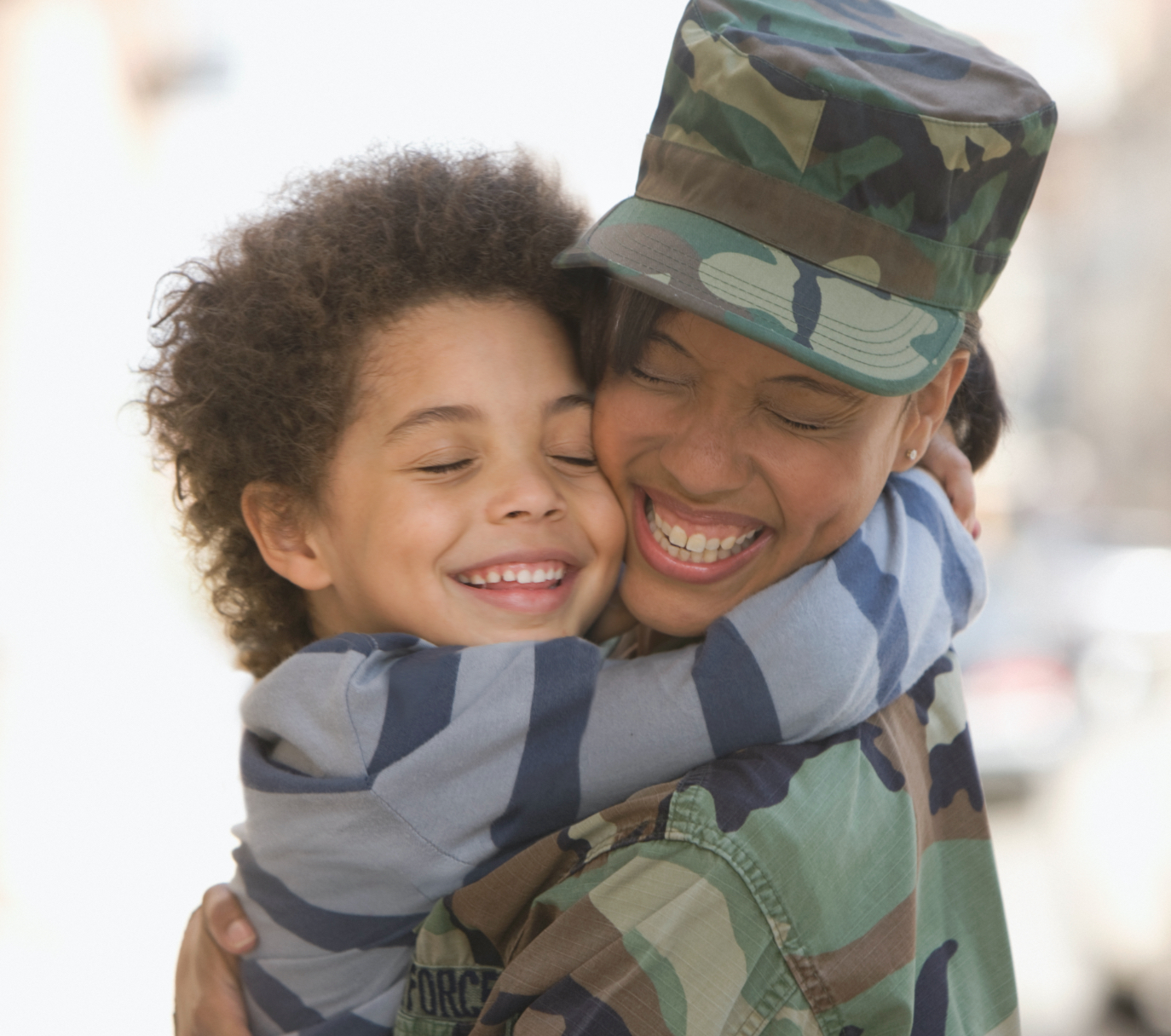 A uniformed officer hugging a loved-one