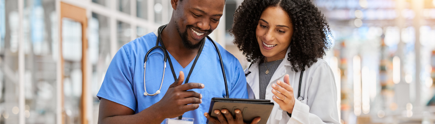 Physicians reading a tablet